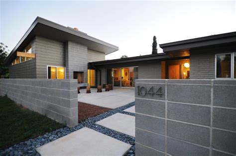 Plan for a modern house with a ground floor and panoramic windows for a sloping plot. images of mid century modern slump block houses - Google ...