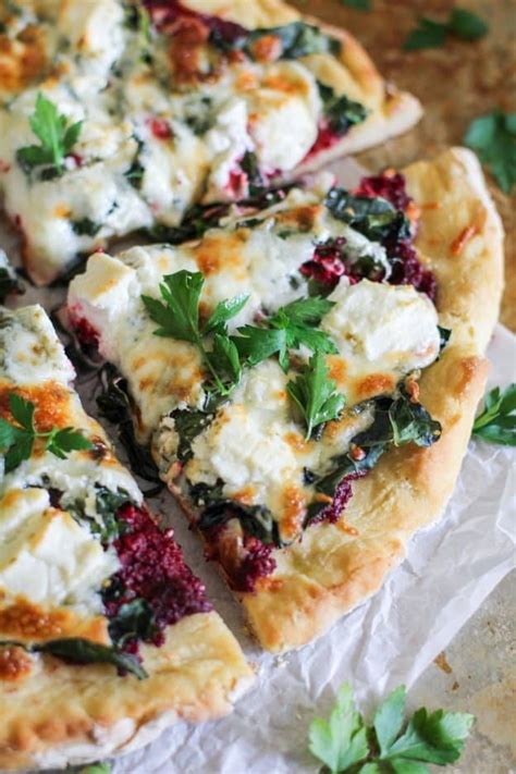 Spread the pesto on the dough. Beet Pesto Pizza with Kale and Goat Cheese