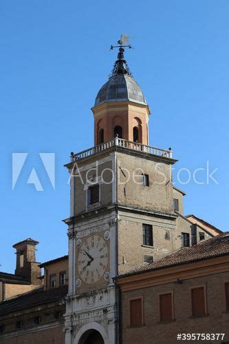 Foto Stock Municipal Historical Tower With Ancient Clock Modena Italy