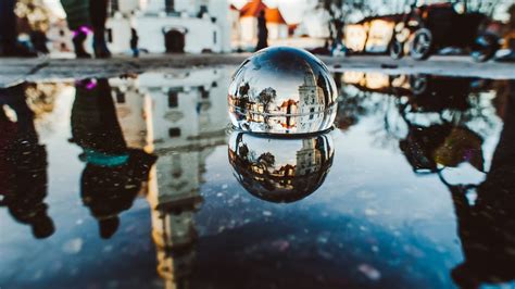 Crystal ball photography vs lensball photography by shooting through the glass ball it becomes a natural frame for your subject. A Different Perspective: Photography through a Glass Ball ...