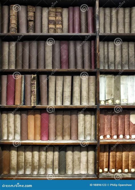 Old Books Stacked On Wooden Shelves Stock Image Image Of Bookshelf