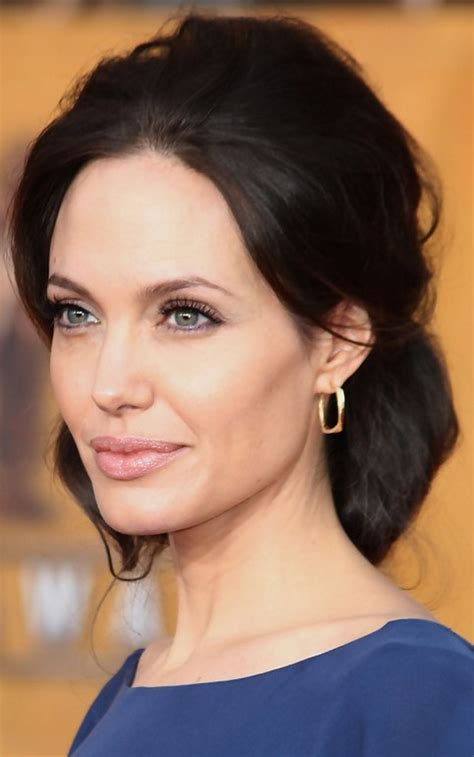 The straight hairstyle is a great option for those looking for simple but stunning hairdo. Angelina Jolie Long Hairstyle: Black Hair with Loose Bun ...