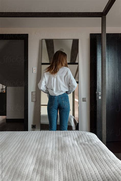 Woman Getting Dressed In Bedroom By Milles Studio For Stocksy United