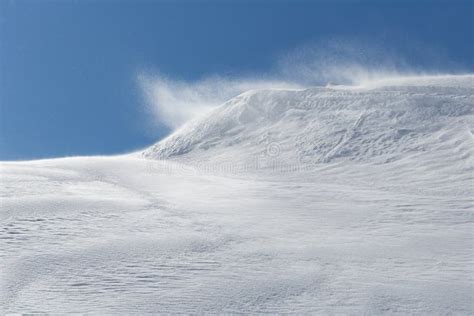 Winter Storm With Wind Blowing Over Snow Cornice In Snowy Landscape
