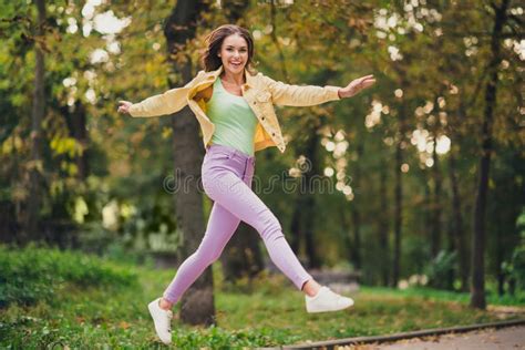 Full Length Body Size View Of Attractive Funky Cheerful Girl Jumping