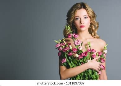 Pretty Naked Woman Holding Bouquet Eustoma Stock Photo
