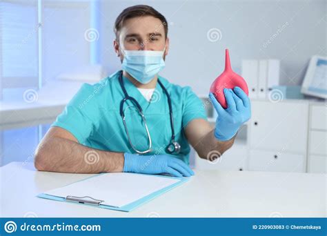 Doctor Holding Rubber Enema At Table In Examination Room Stock Image Image Of Intoxication