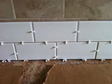 Unless you want a larger gap, no additional spacers are needed. Renov8or: Tiling Over Tile: Subway Tile Backsplash