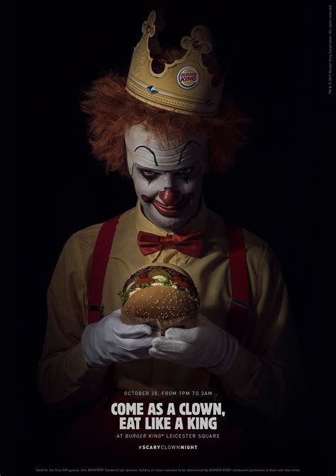 The Clown Is Holding A Burger In His Hands