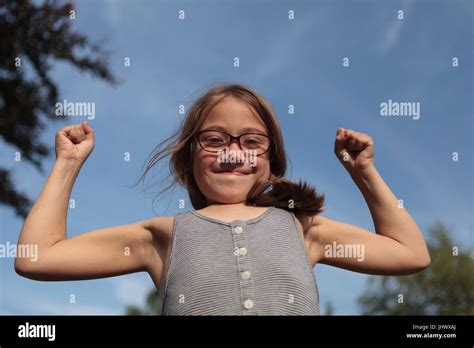 Young Girl Flexing Her Muscles Stock Photo Alamy