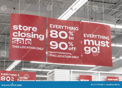 Store Closing And Huge Discount Signs Displayed At A Soon To Be Out Of