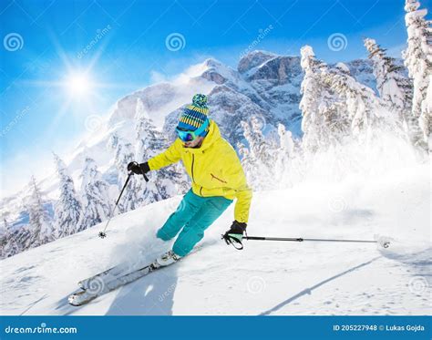 Skier Skiing Downhill During Sunny Day Stock Photo Image Of Cool
