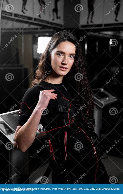 Girl In Ems Suit In Gym Sport Training In Electrical Muscle