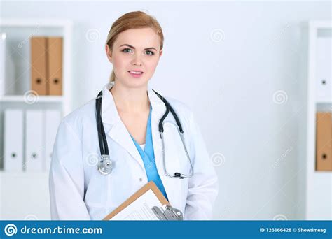 Beautiful Female Medical Doctor Standing At Hospital. Physician Is ...