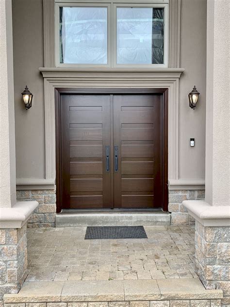 The Front Entrance To A House With Two Double Doors