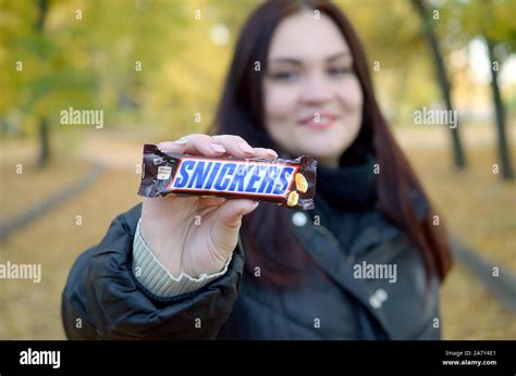 Kharkov Ukraine October 8 2019 A Young Caucasian Brunette Girl Shows Snickers Chocolate Bar