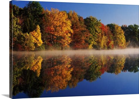 Layer Of Mist On Hidden Lake Autumn Color Trees With Water Reflection