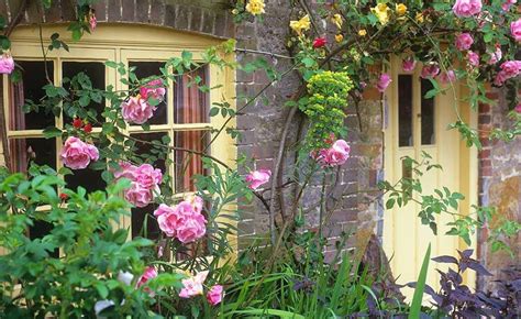 A Quintessential English Cottage Garden Brings To Mind Romantic