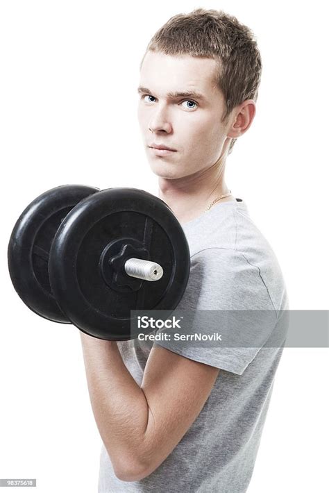 Concentrated Young Man Lift Weights Stock Photo Download Image Now