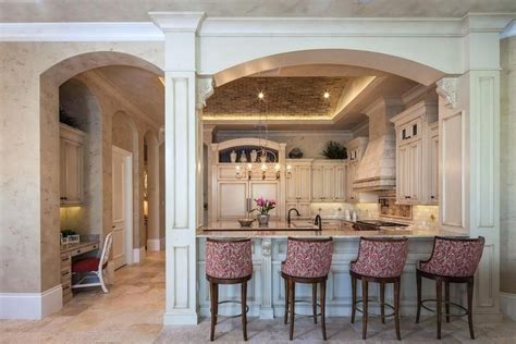 Wet bar ideas should swirl in your head when you see one like this. stained wood moldings under breakfast bar | Traditional ...