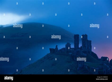 Corfe Castle In The Mist At Dawn Dorset England Uk Stock Photo Alamy