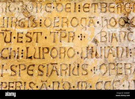 Ancient Latin Script On A Stone Of A House Wall In Florence Italy