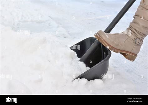 Woman Shoveling Snow Shovel Hi Res Stock Photography And Images Alamy