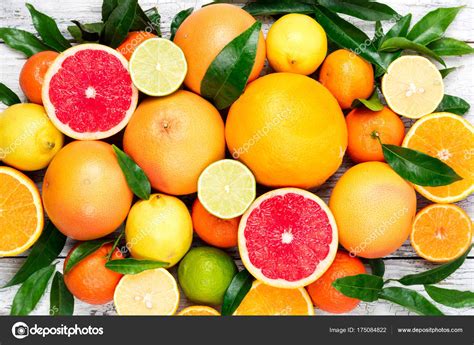 Citrus Fruits Background Assorted Fresh Citrus Fruits With Leaves