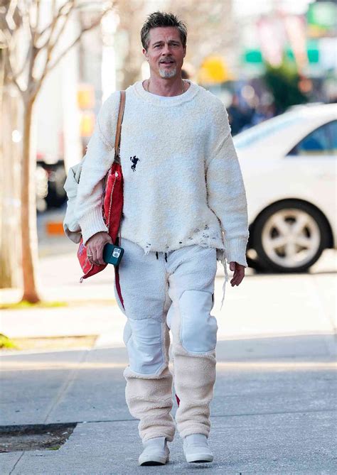Brad Pitt Steps Out In Destroyed Monochromatic Sweater And Pants