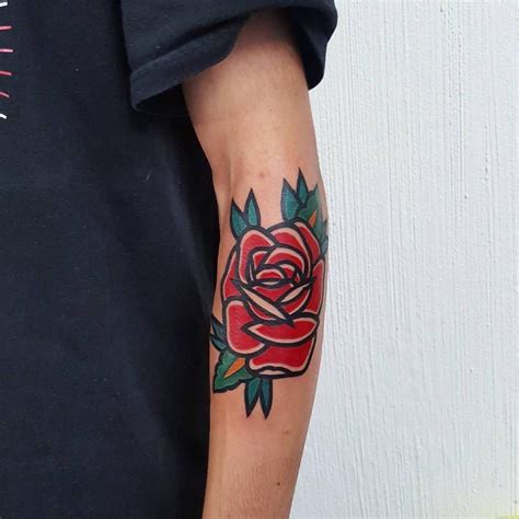 Bold Traditional Red Rose Tattoo On The Left Forearm Tattoo Artist
