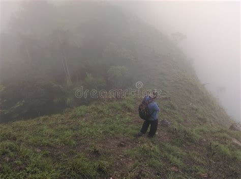 Unidentified Trekker Enjoying The Foggy Nature Beautiful Foggy