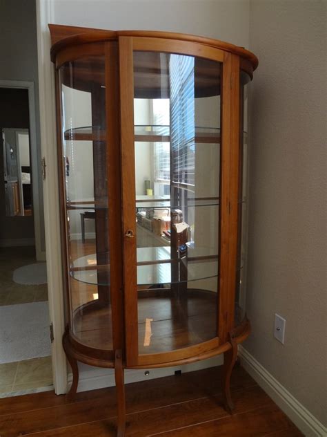 Show off your favorite trophy collection mirrored curio cabinets create an illusion of a larger space with their reflection. Curved Glass Curio Cabinet Value | My Antique Furniture ...