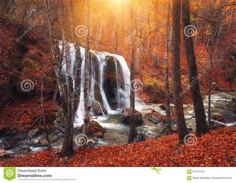 Waterfall At Mountain River In Autumn Forest At Sunset Stock Image