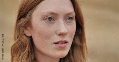 Close Up Portrait Of Mysterious Ginger Young Woman Opening Her Blue