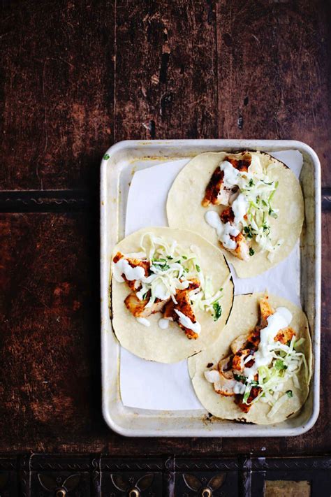 Spicy fish tacos with cabbage slaw and lime crema. Spicy Fish Tacos with Cabbage Slaw + Lime Crema | Spicy ...