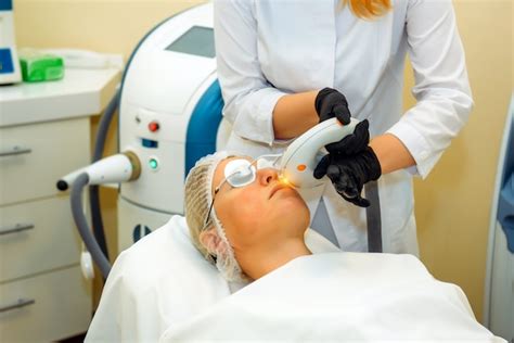 Premium Photo Dermatologist With Laser Device Makes Facial Rejuvenation Procedure For A Woman