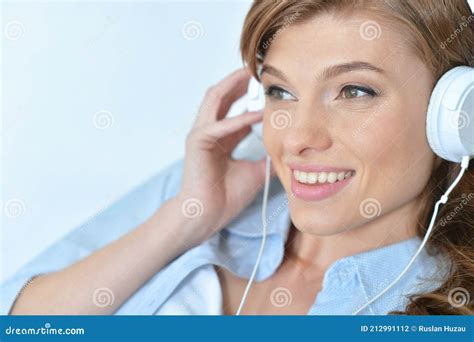 Portrait Of Young Woman Listening Music With Headphones Stock Photo