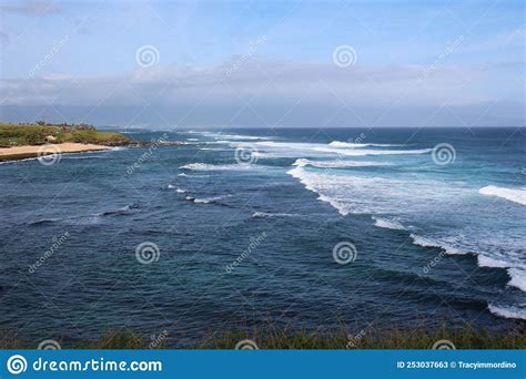Waves Of The Pacific Ocean Rolling Into Hookipa Beach In Paia Maui