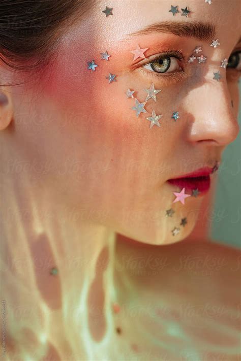 Closeup Portrait Of Pretty Girl With Silver Stars On Her Face In Unusual Light By Liliya