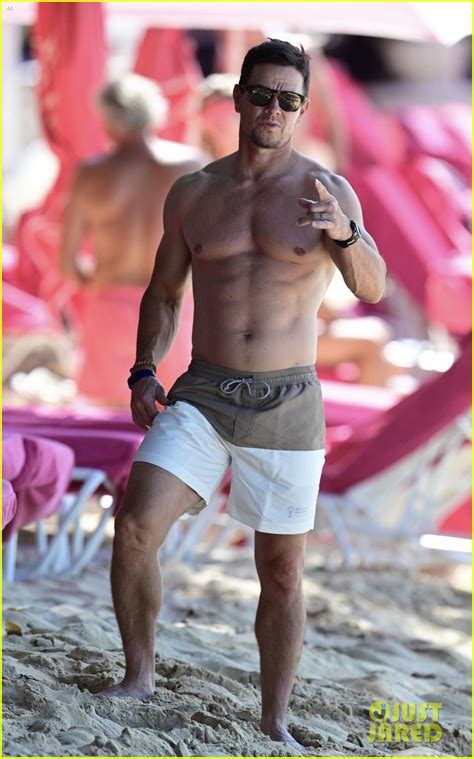 mark wahlberg continues to showcase his impressive swimsuit collection during barbados vacation