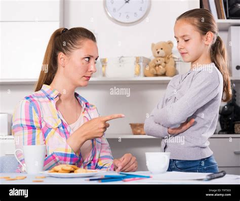 Young Mother Scolding Her Daughter For Bad Behavior And Mistakes Stock