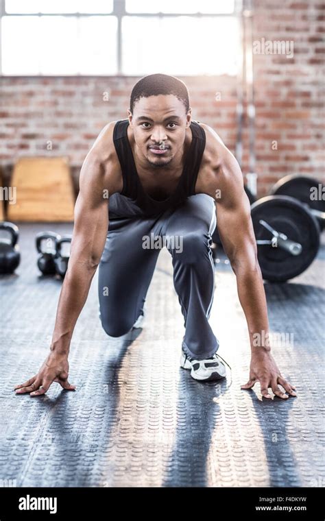 Muscular Man Doing Stretching Exercises Stock Photo Alamy