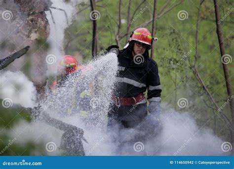 Firefighters Using Water Hoses To Extinguish A Fire Editorial Photography Image Of Heat