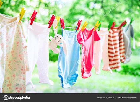 Baby Clothes Hanging On The Clothesline Stock Photo By ©nataliad 163408928