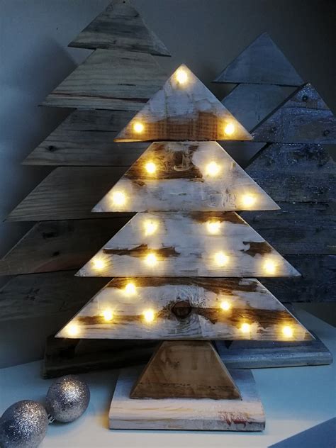 A Wooden Christmas Tree With Lights On It