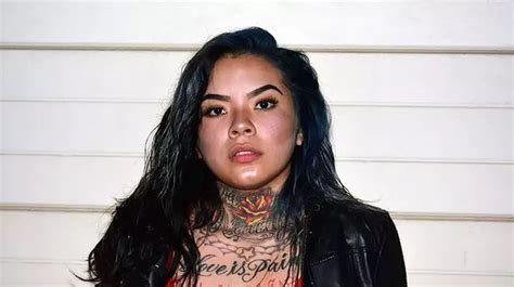 female gang member with neck and chest tattoos dubbed next hot felon after mugshot goes viral