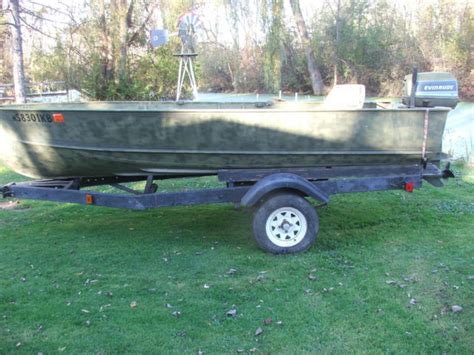 14 Ft Lund Boat And Trailer 30 Hp Evinrude Tiller Outboard Fishing Duck