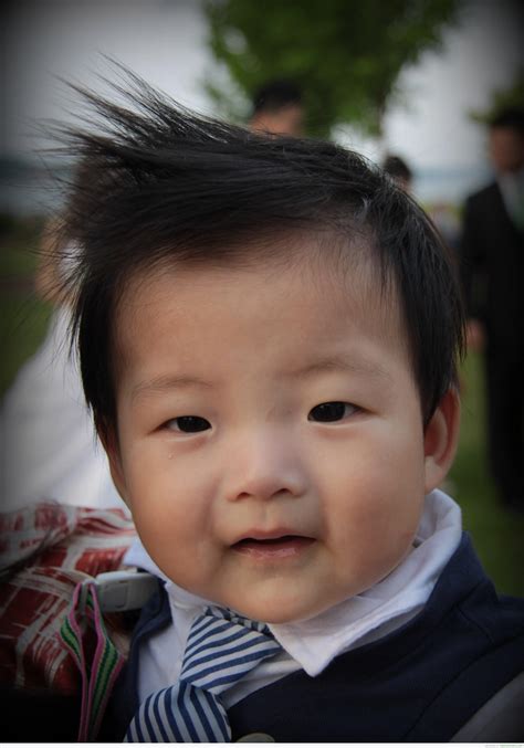 A cool hairstyle for boys with medium to long hair, the samurai bun style is easy to achieve. Baby Boy nice Hair Style - DesiComments.com