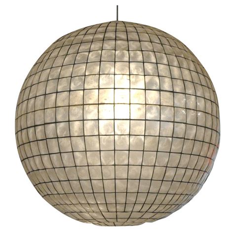 Unfortunately, fans are an absolute must in our house, which limits the fixtures we can buy. Capiz Shell Globe Light