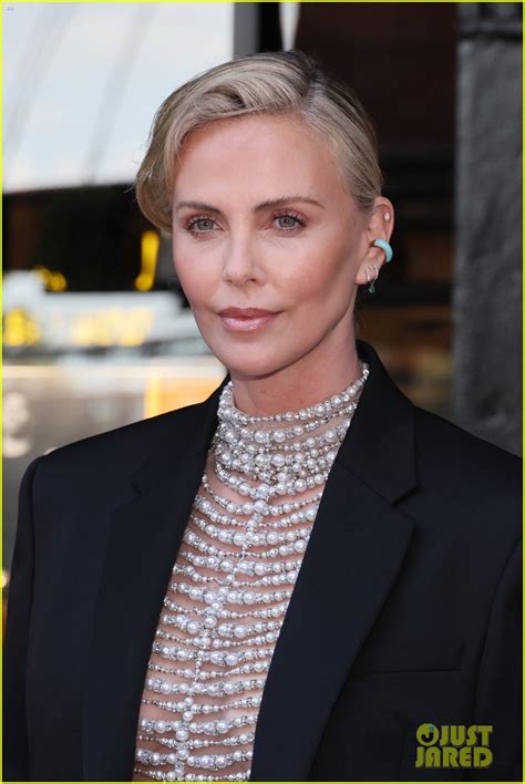 Charlize Theron Wears A Daring Pearl Top For Breitling S Boutique